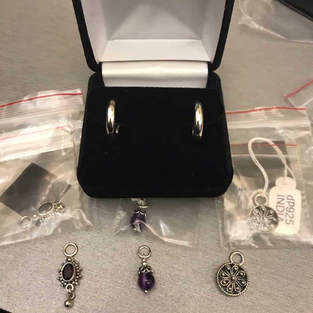 Hoop earrings with three sets of charms